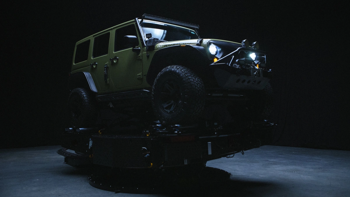 A vehicle under atmospheric lighting in the PXO Akira system.