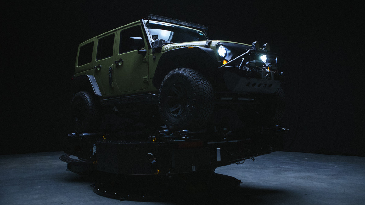 A vehicle under atmospheric lighting in the PXO Akira system.