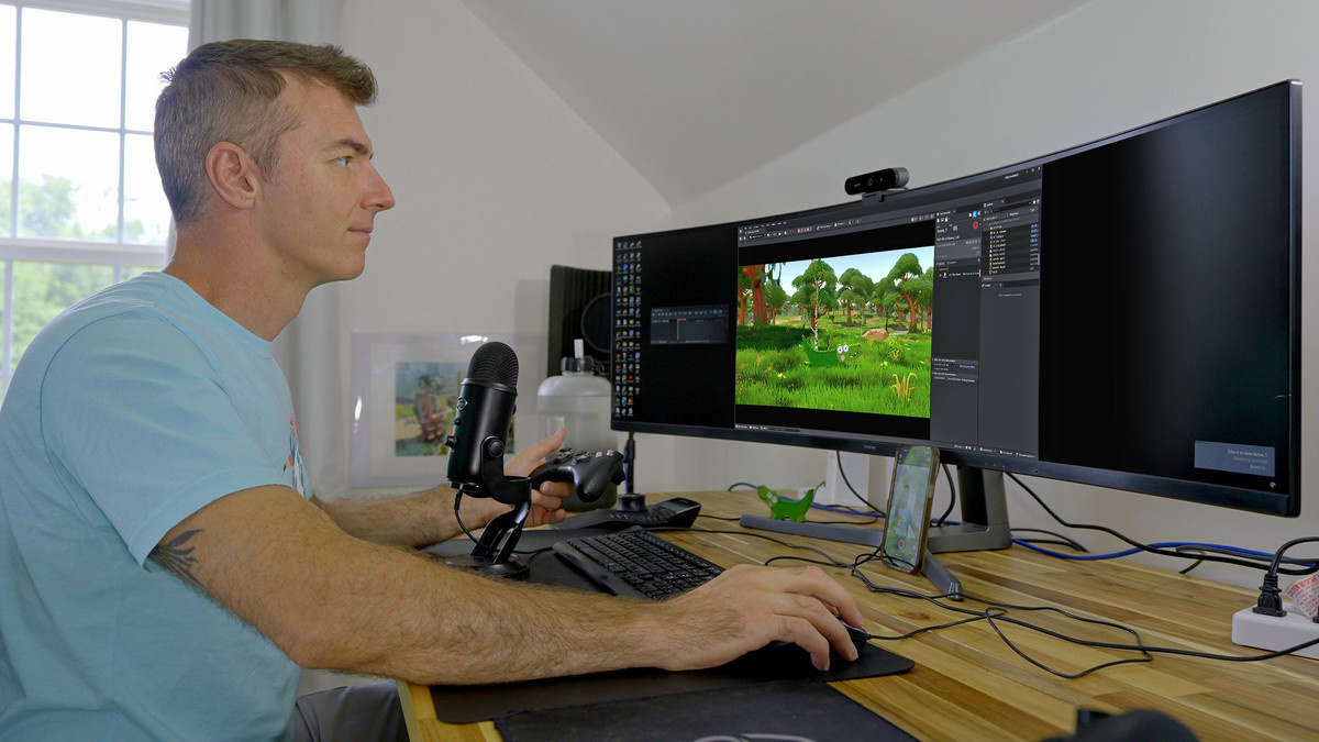 Cory Williams sits at his desk working on a Silly Crocodile episode on his computer.