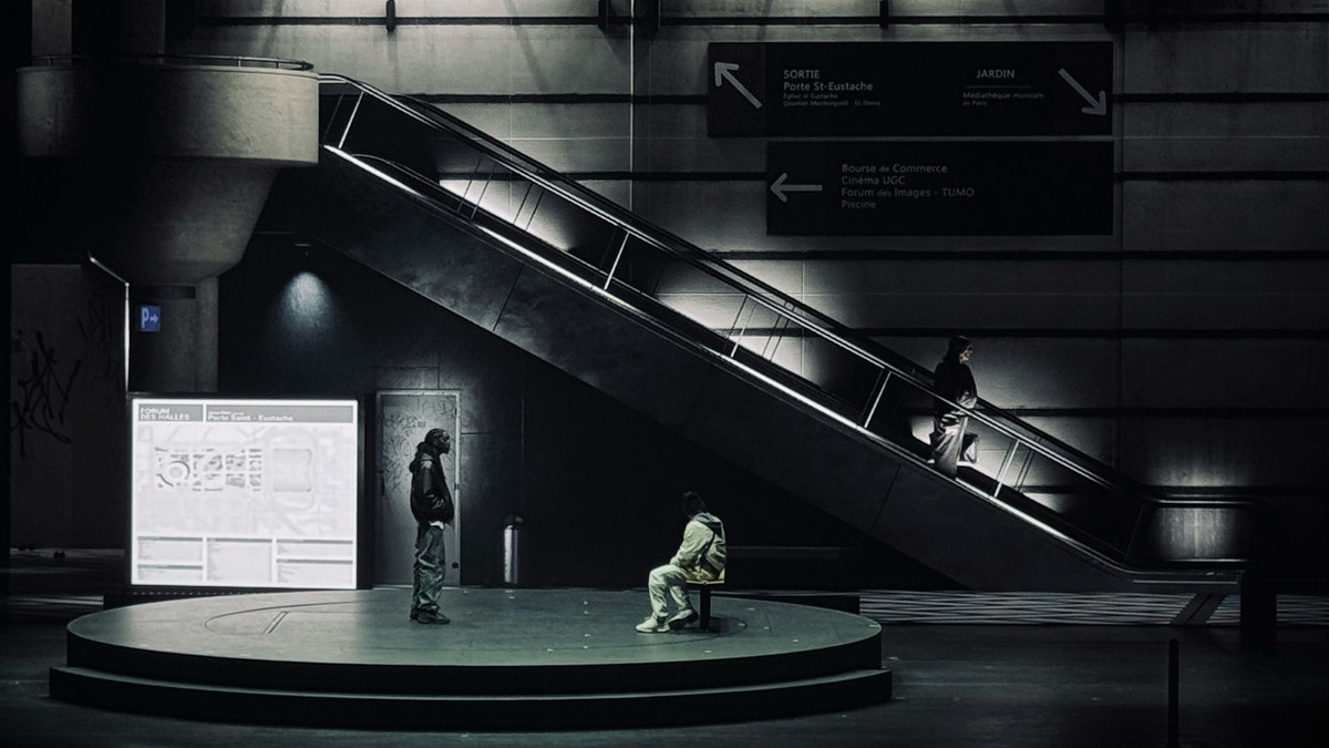 Characters hang out in a train station in ‘La Haine: Jusqu’ici rien n’a changé’.