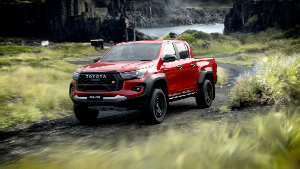 A red Toyota pickup truck goes off-road in a Rotor Studios visualization.