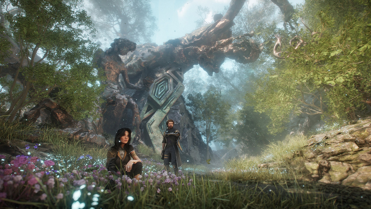Characters relax in a meadow in ‘Clair Obscur: Expedition 33’.