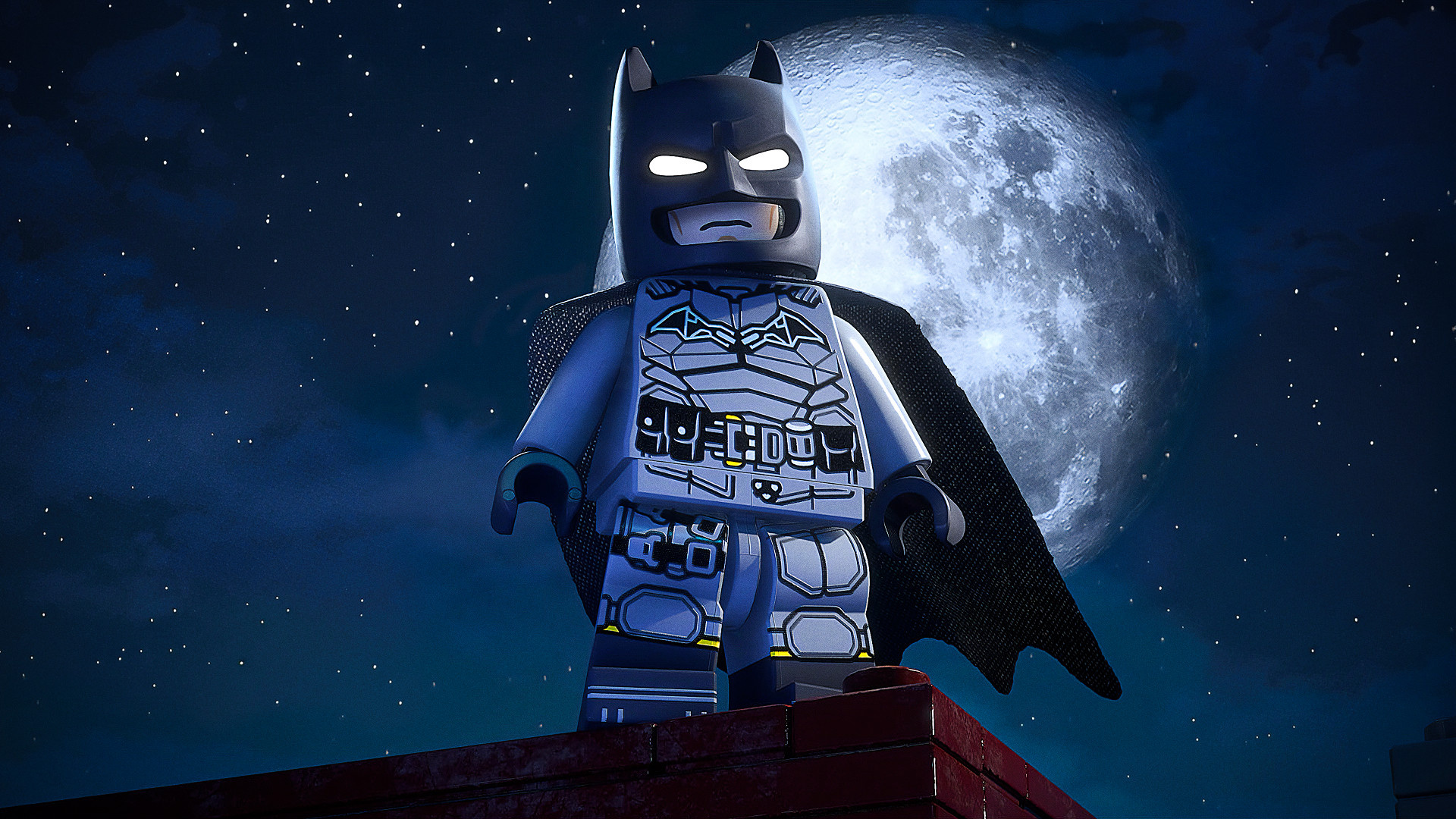 「LEGO Batman: Legacy of the Dark Knight」で月明かりに照らされた屋上に立つレゴ バットマン。