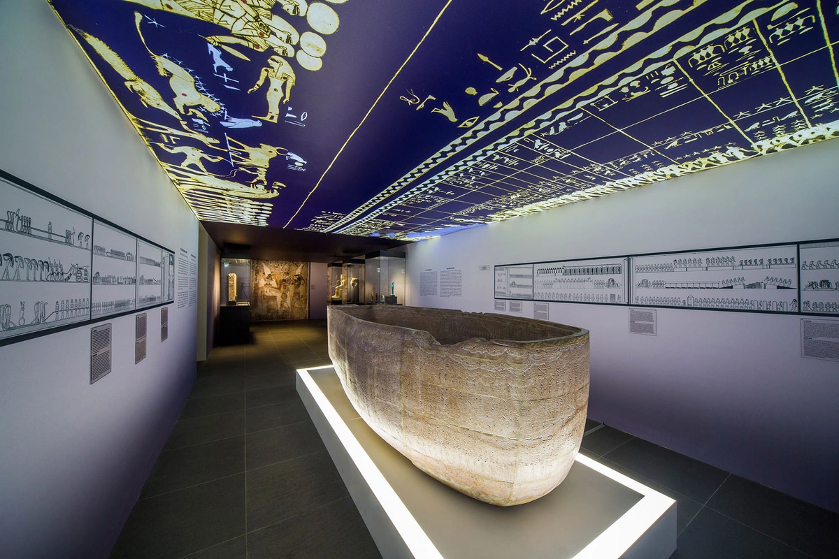 Seti I sarcophagus at Basel exhibition with hieroglyphics explained.